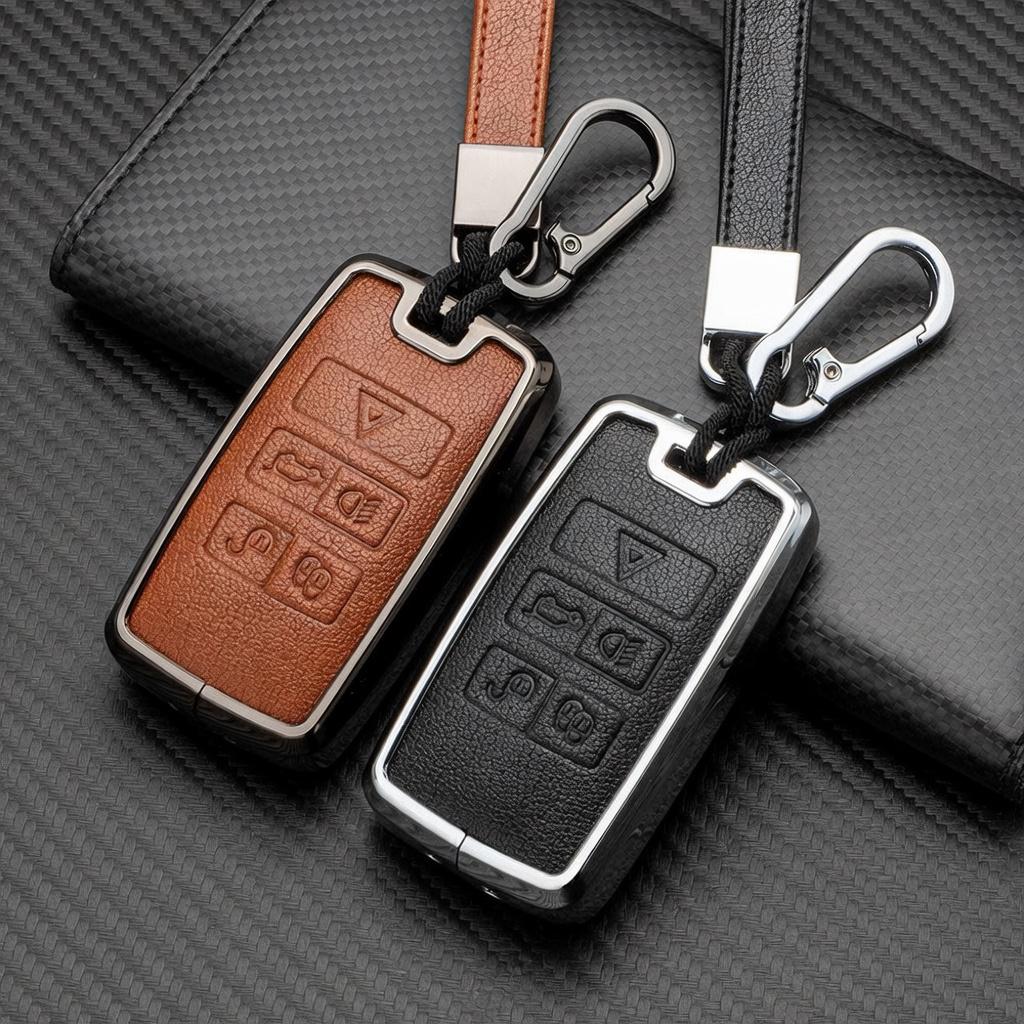 Leather and aluminum Land Rover and Jaguar key fob cover set with matching keychain by Kollen US, shown on a plain background.