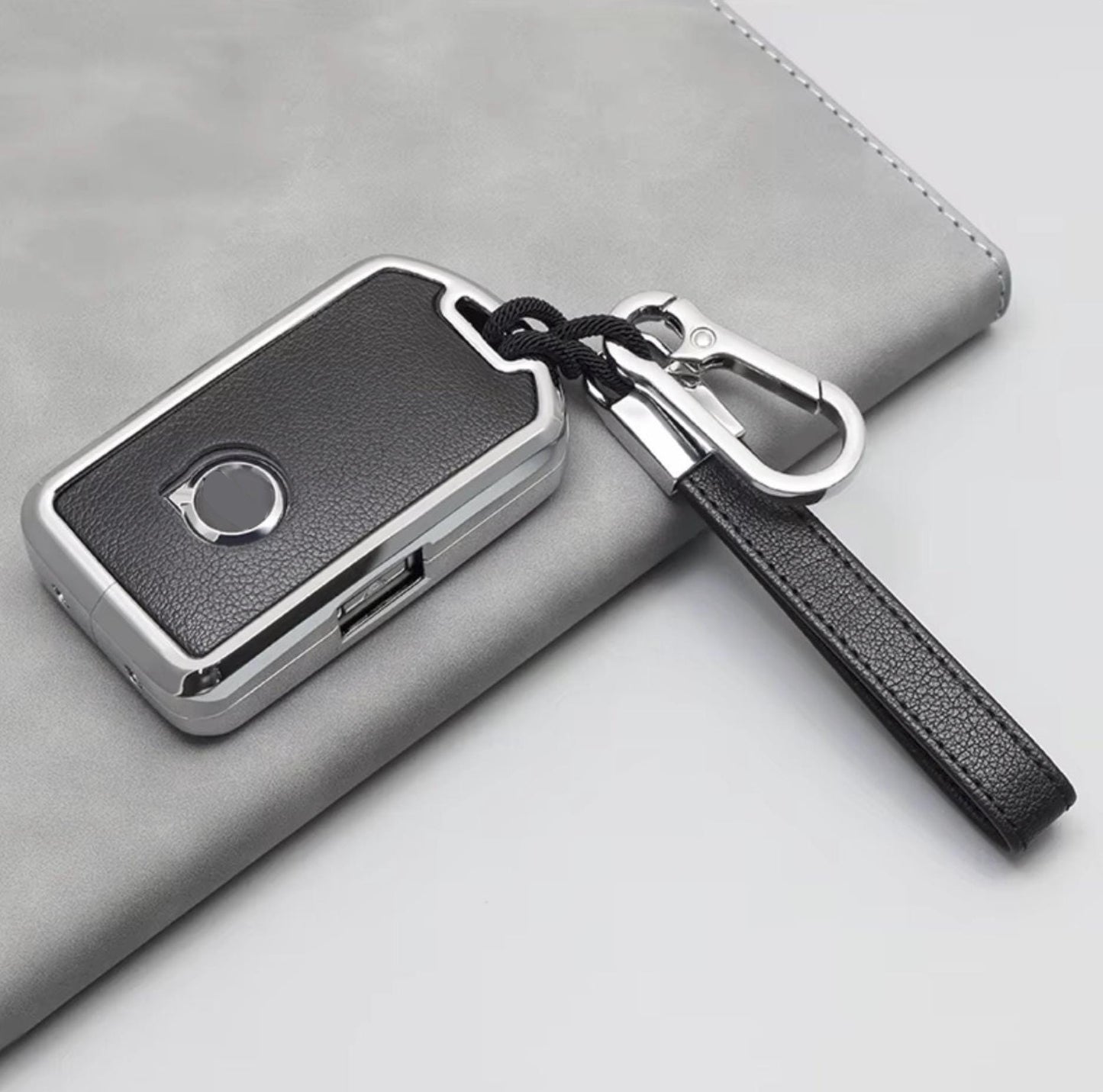 Volvo and Polestar key fob cover set by Kollen US featuring leather and aluminum keychains on a white background.