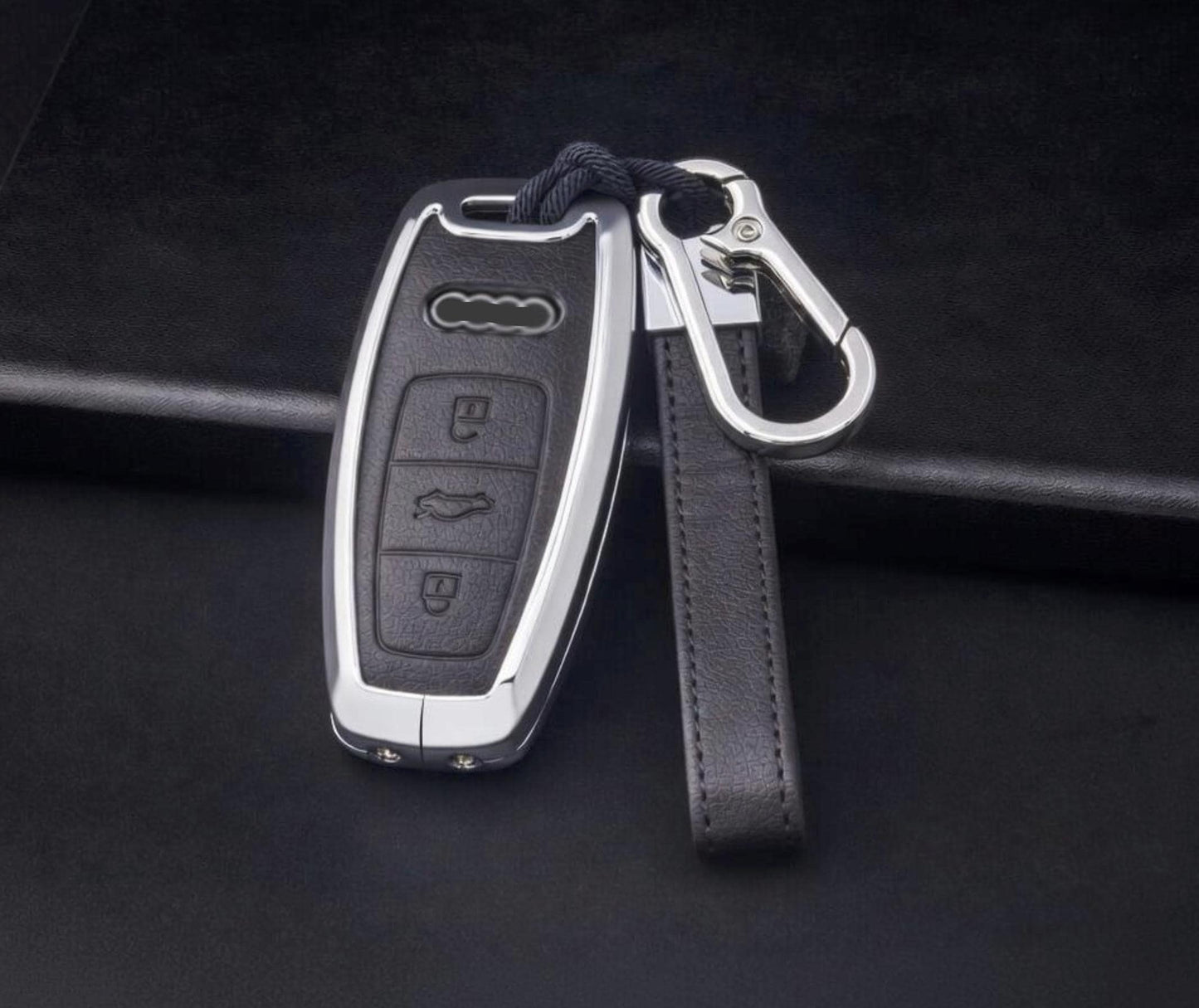 Leather and aluminum Audi key fob cover for A4 to E-Tron models, stylish keychain accessory by Kollen US.