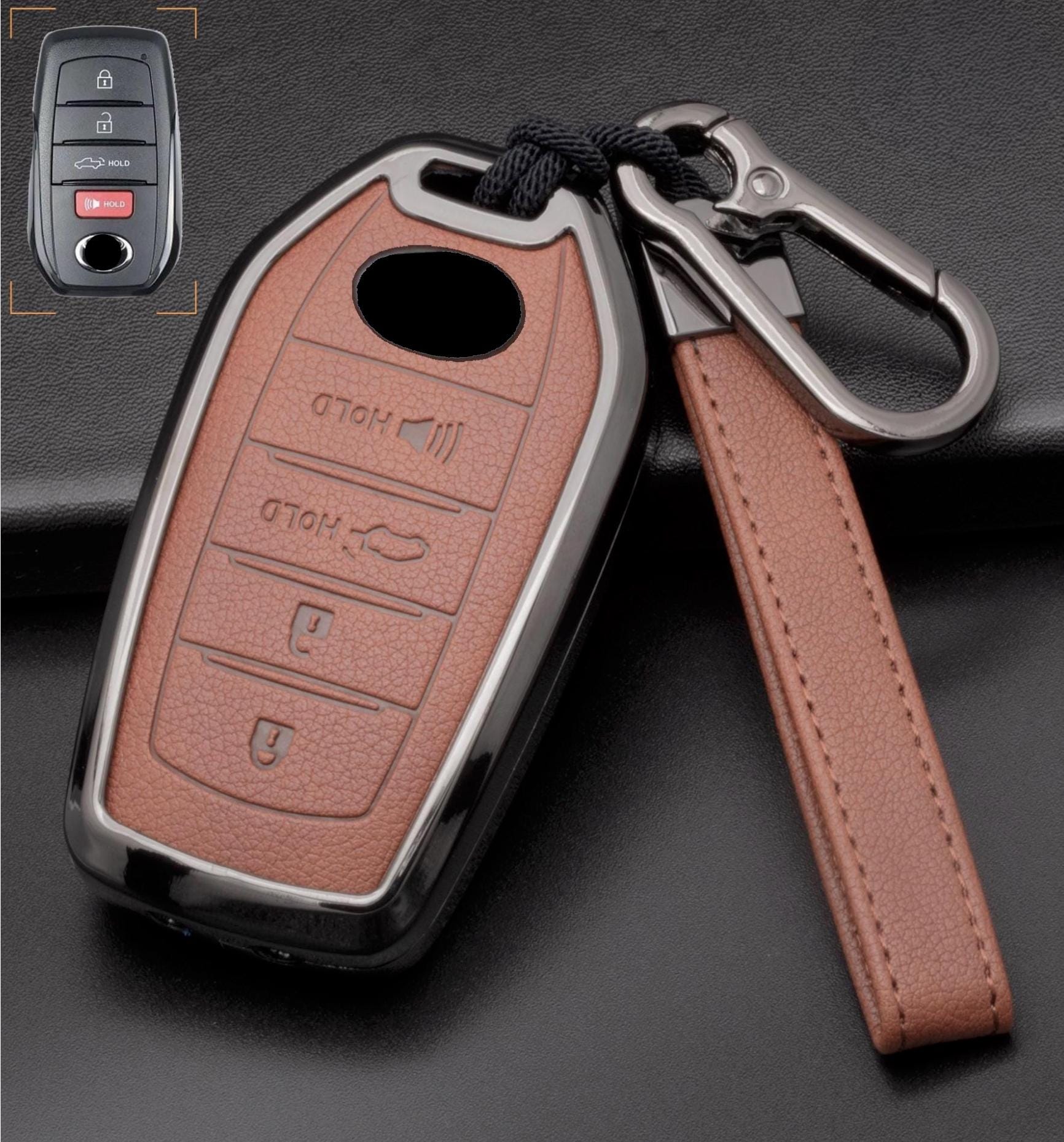 Customizable leather Toyota key fob cover with aluminum shell and keychain, featuring four-button design by Mestiere Coriaceo.
