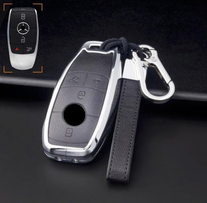 Customizable leather and aluminum Mercedes-Benz key fob cover set with keychain by Mestiere Coriaceo, featuring sleek design and durable materials.