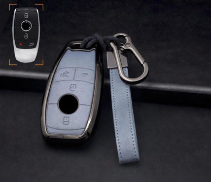 Customizable leather and aluminum Mercedes-Benz key fob cover set with keychain by Mestiere Coriaceo, featuring stylish design and branding