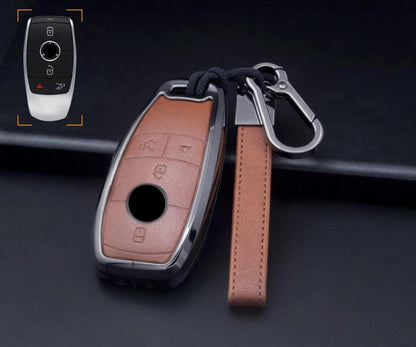 Customizable leather and aluminum Mercedes-Benz key fob cover set with keychain by Mestiere Coriaceo, featuring sleek design and durable materials.