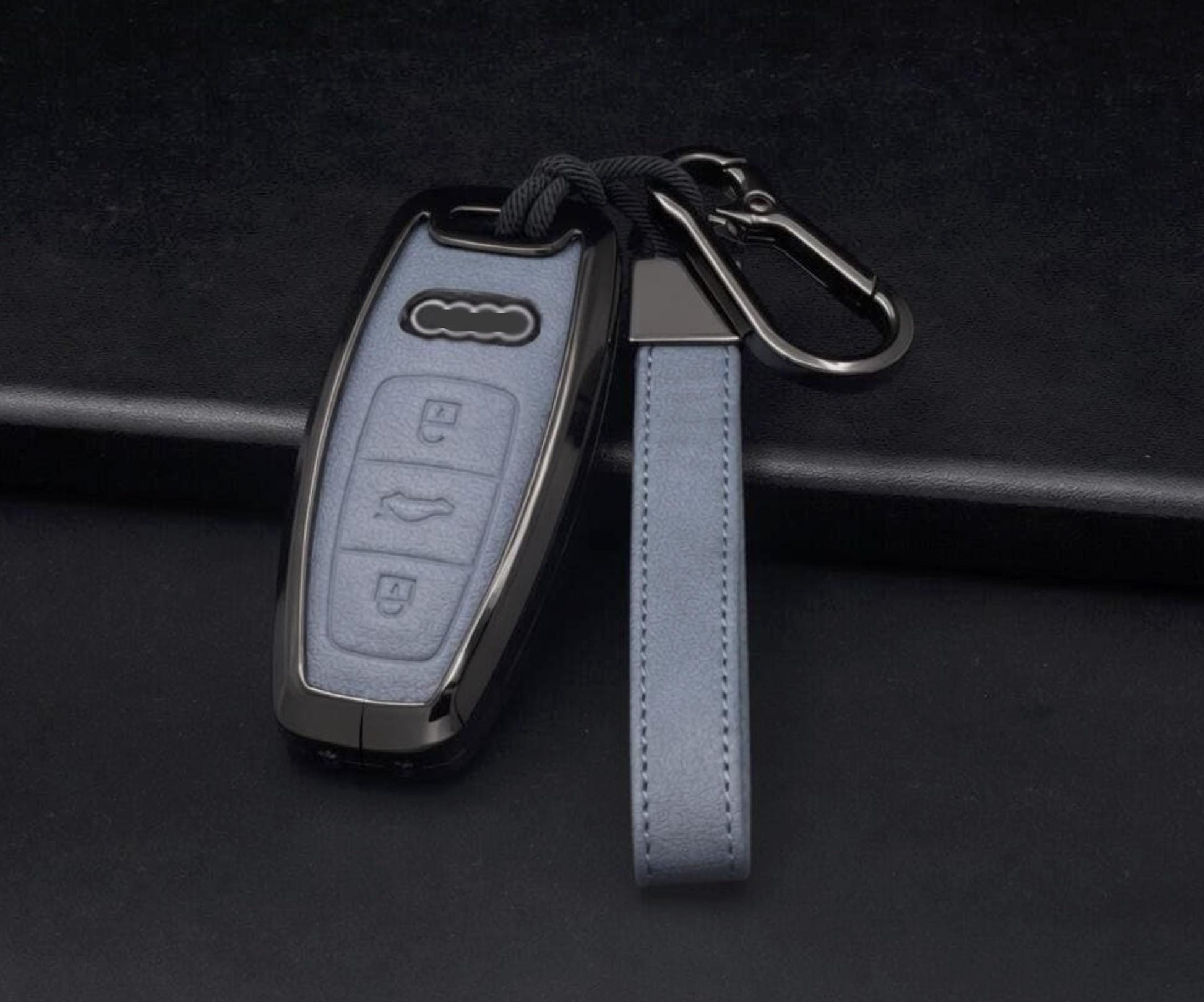 Leather and aluminum Audi key fob cover by Kollen US for A4-A8, Q5, Q8, RS, and E-Tron keychains, shown on a key.