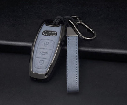 Leather and aluminum Audi key fob cover by Kollen US for A4-A8, Q5, Q8, RS, and E-Tron keychains, shown on a key.