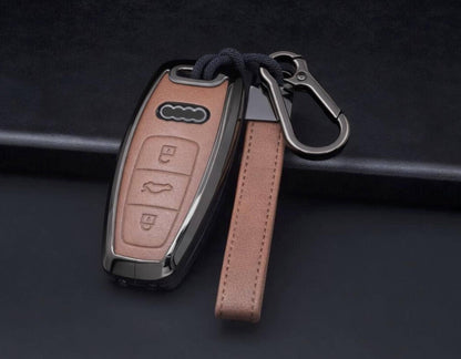 Audi key fob cover by Kollen US featuring leather and aluminum, designed for A4-A8, Q5, Q8, RS, and E-Tron models.