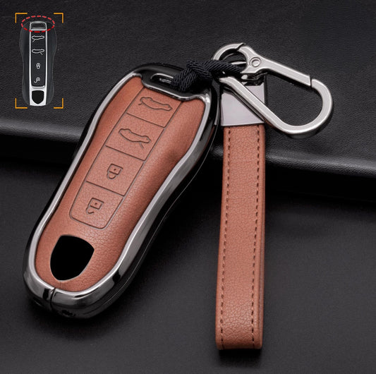 Customizable leather and aluminum Porsche key fob cover with 4-button keychain by Mestiere Coriaceo, designed for Porsche vehicle keys.