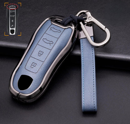 Customizable leather and aluminum Porsche key fob cover with 4-button keychain by Mestiere Coriaceo, featuring a sleek design.